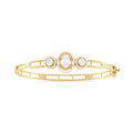 Three-Stone Diamond Bangle in Yellow Gold – Oval Center Halo Bracelet