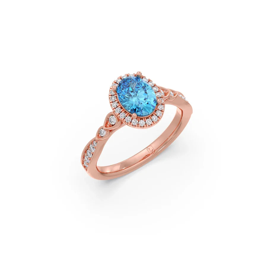 Blue Oval Gemstone Ring in Yellow Gold – Halo Diamond Design