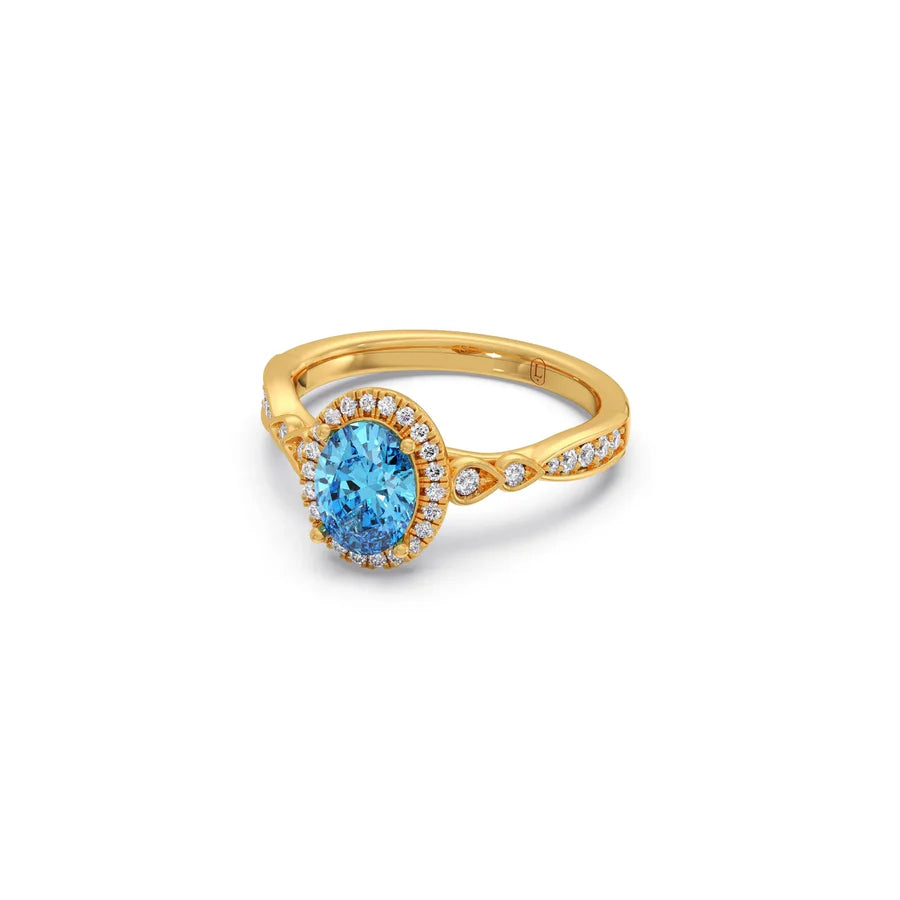 Blue Oval Gemstone Ring in Yellow Gold – Halo Diamond Design